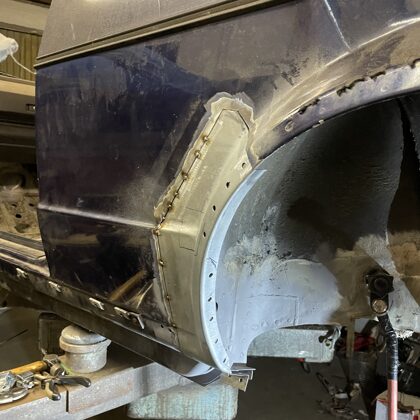 New section of sheet metal arch located and tack welded into posistion 